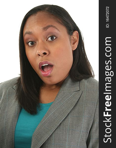 Attractive thirty year old woman in business suit with surprised expression over white background. Attractive thirty year old woman in business suit with surprised expression over white background.