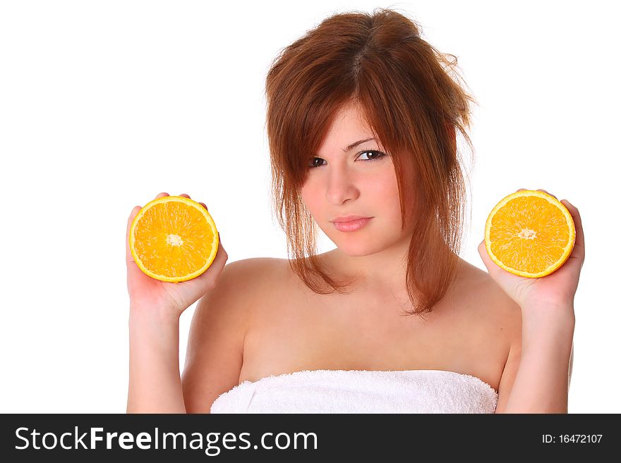 Smiling young healthy woman holding the orange isolated on white. Smiling young healthy woman holding the orange isolated on white