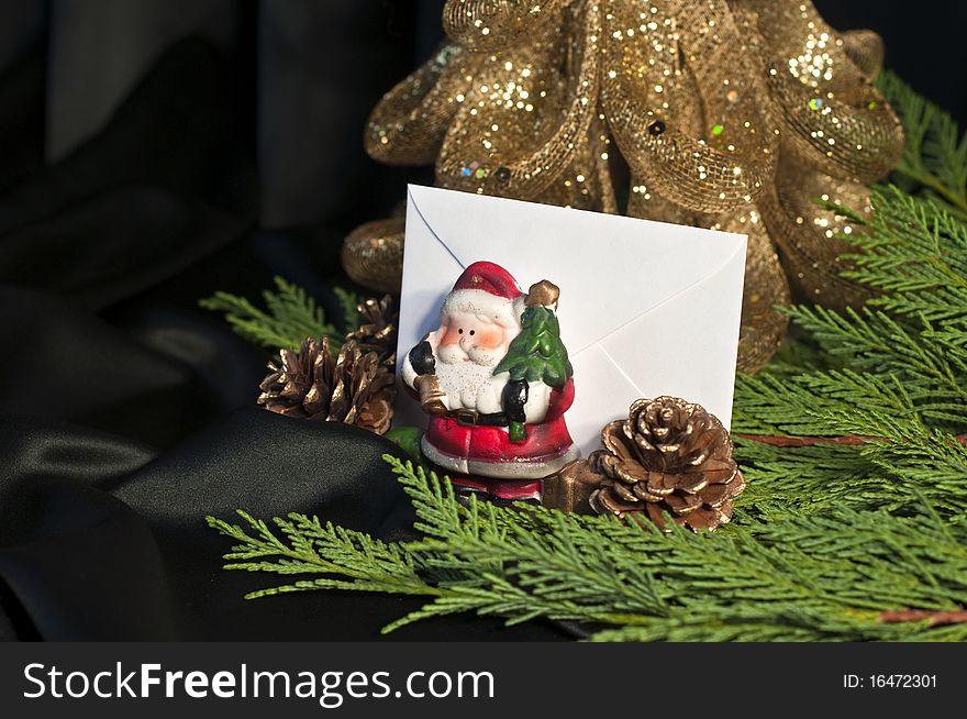 Composition of Christmas and Santa Claus with bag on a black background. Composition of Christmas and Santa Claus with bag on a black background