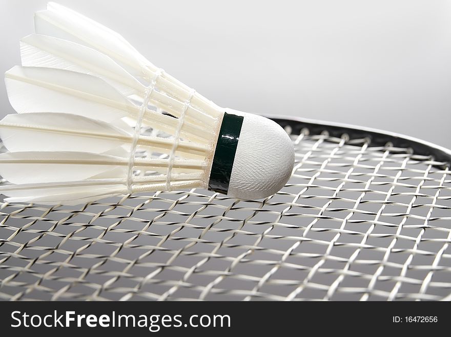 Close-up of badminton shuttlecock on the racket. Horizontal. Close-up of badminton shuttlecock on the racket. Horizontal