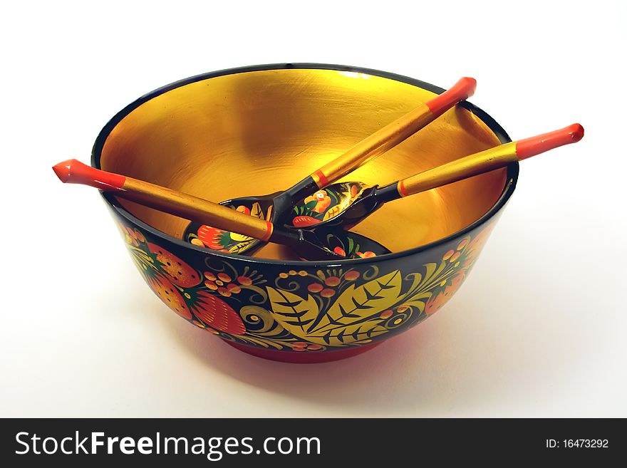 Khokhloma bowl and three Khokhloma tea spoons. Khokhloma bowl and three Khokhloma tea spoons.