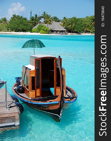 Boat in a crystal water of indian ocean in Maldives. Boat in a crystal water of indian ocean in Maldives