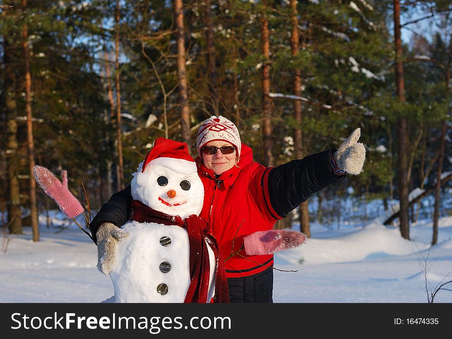 Woman Poses With Snowman