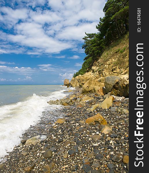 Seacoast summer landscape with rocks and sky. Seacoast summer landscape with rocks and sky