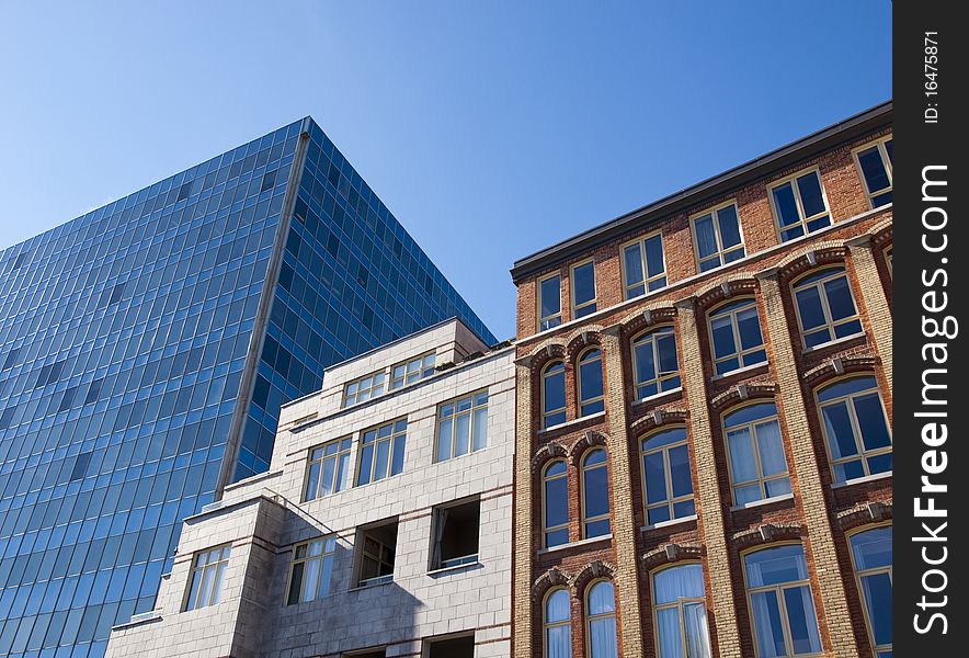 Three buildings of different style beside each other. Three buildings of different style beside each other