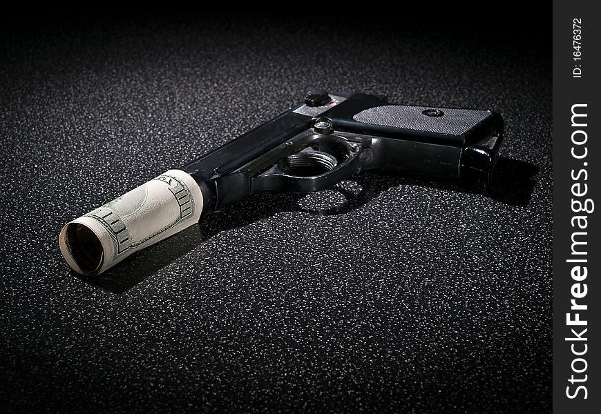 Handgun with imitation of silencer from dollar greenback. Handgun with imitation of silencer from dollar greenback