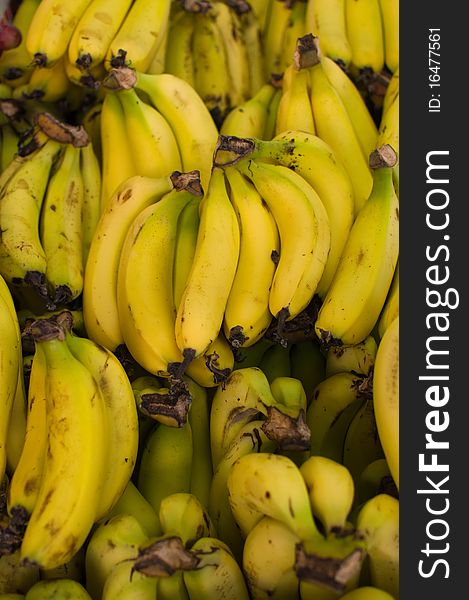 Fresh natural bananas to background .