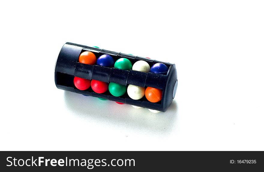 Puzzle with color spheres on a white background