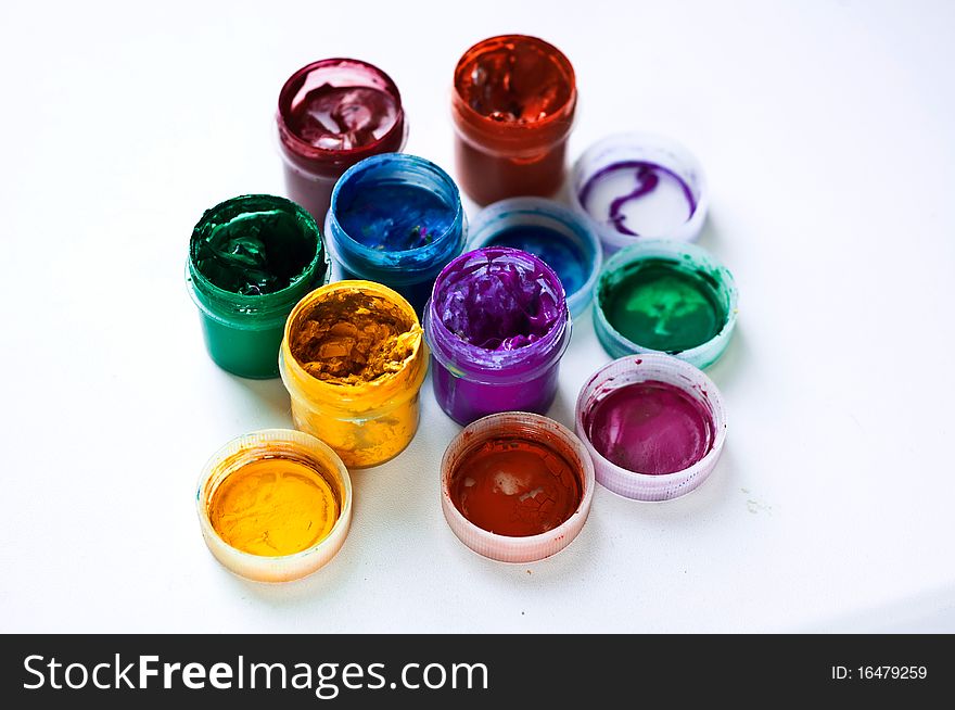 Banks with a multi-colored paint on a white background. Banks with a multi-colored paint on a white background
