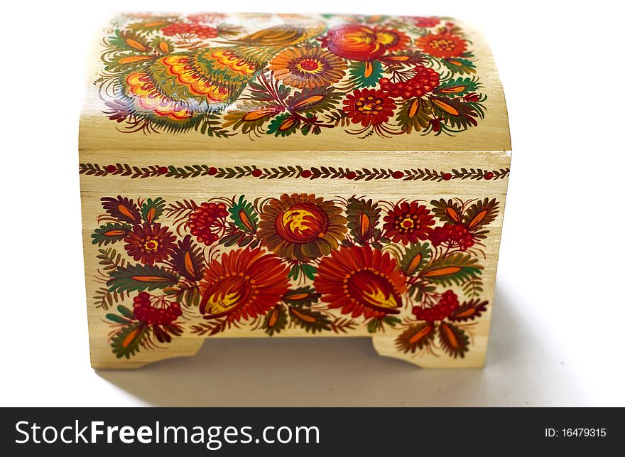 Wooden casket with Russian patterns on a white background