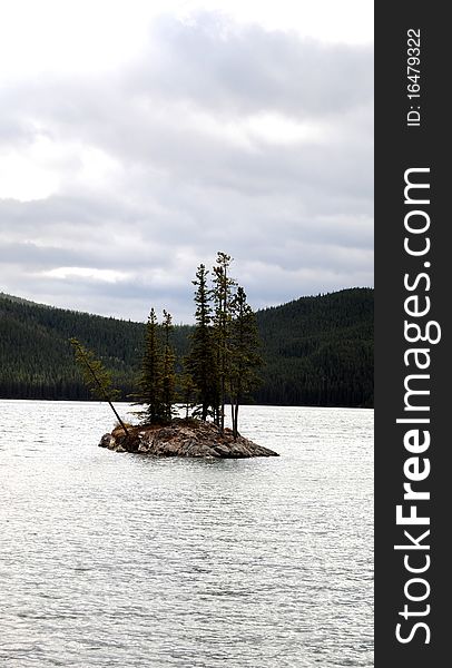 Small island in the middle of a lake, British Columbia, Canada. Small island in the middle of a lake, British Columbia, Canada.