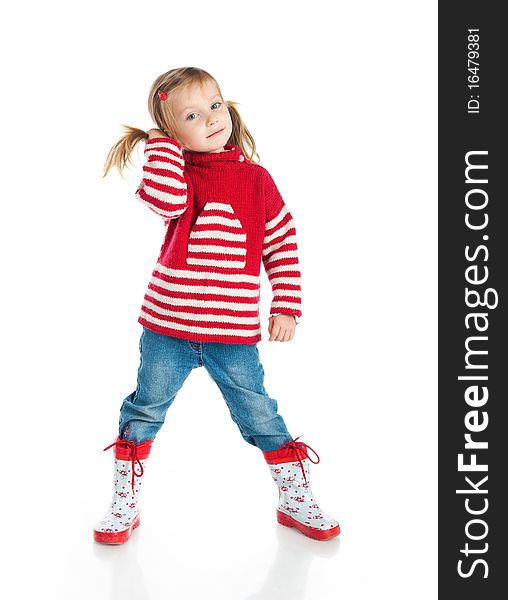 Little girl wearing sweater and gumboots isolated on white