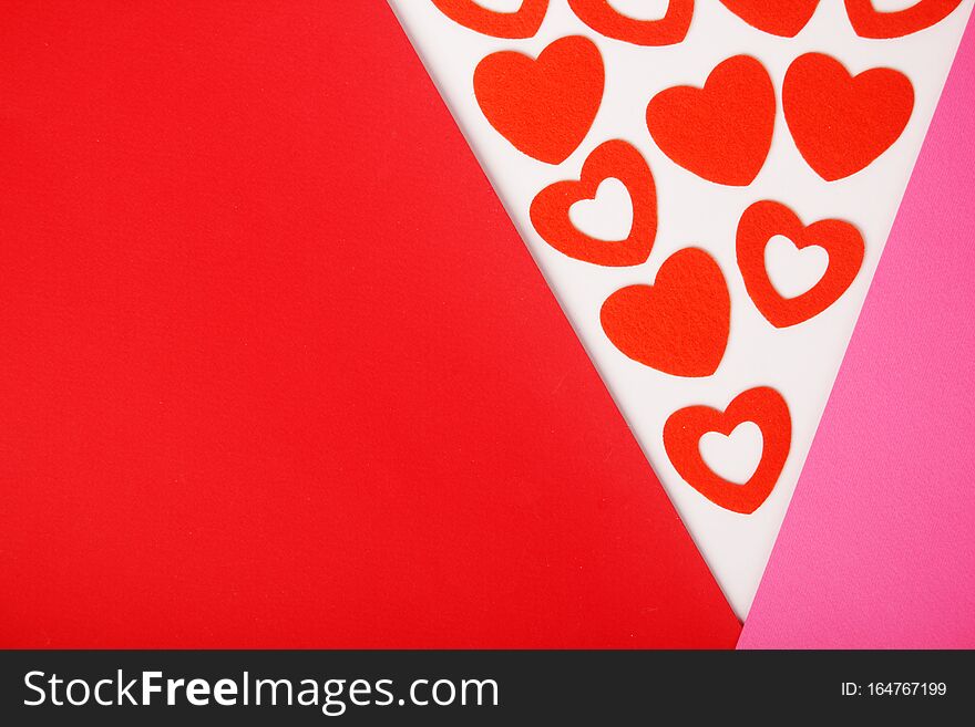 Red and pink flat background with hearts for Valentine Day celebration