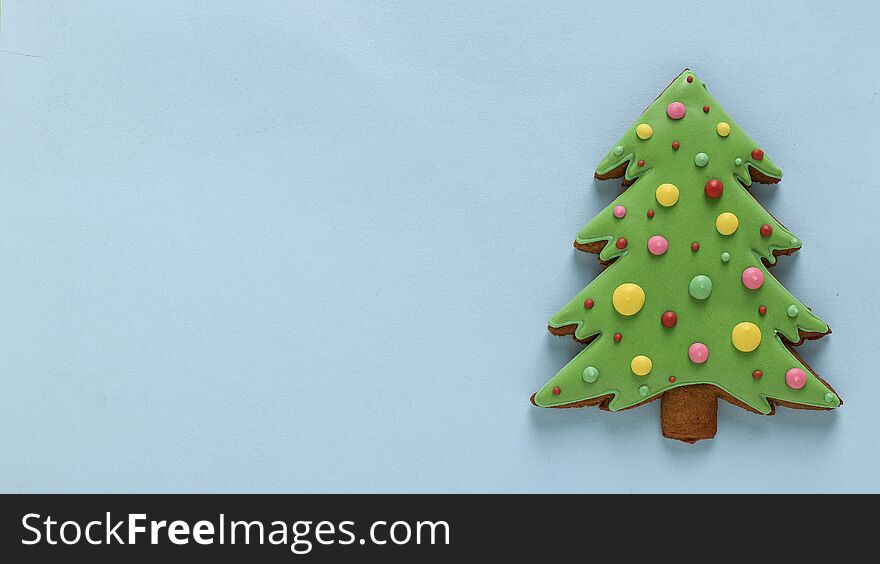 Edible Christmas tree, gingerbread, Happy New Year, blue background, Copy space, horizontal orientation