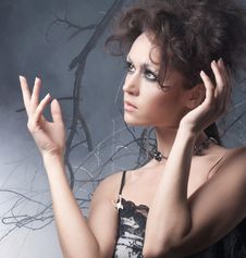 Fashion Shot Of A Young Brunette In A Dark Dress Royalty Free Stock Image