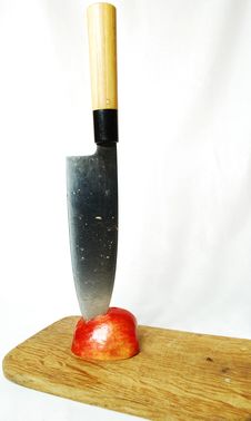Half An Apple In It Plunged The Knife Stock Images