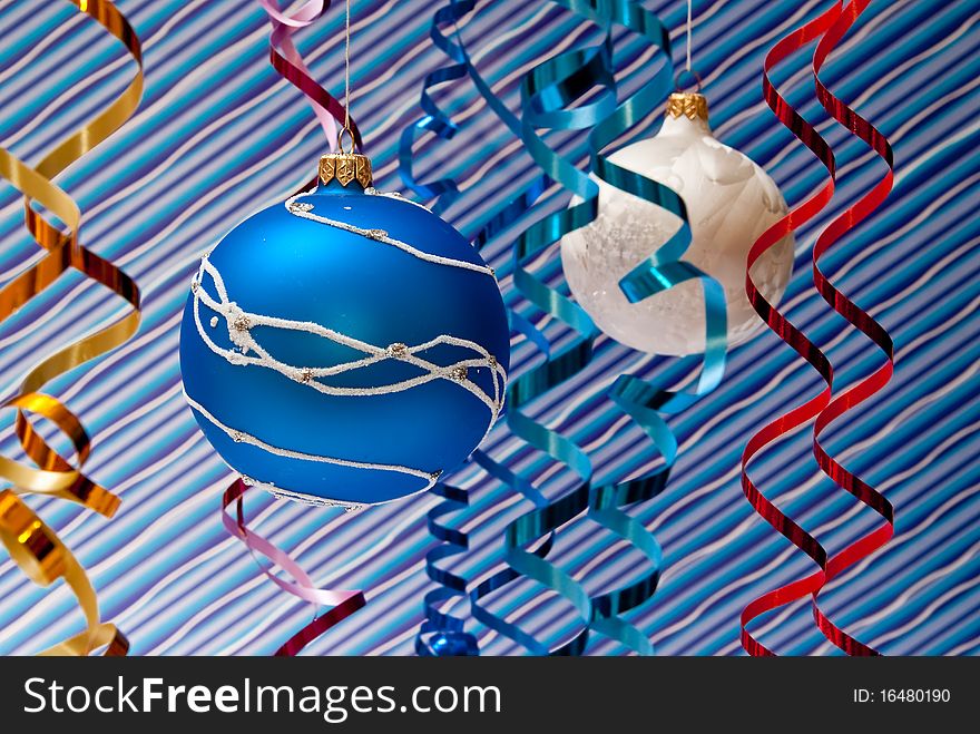 Christmas decoration from two blue and white balls. Blue background. Christmas decoration from two blue and white balls. Blue background