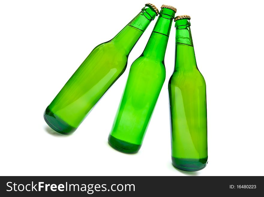 Three beer bottles on white background.