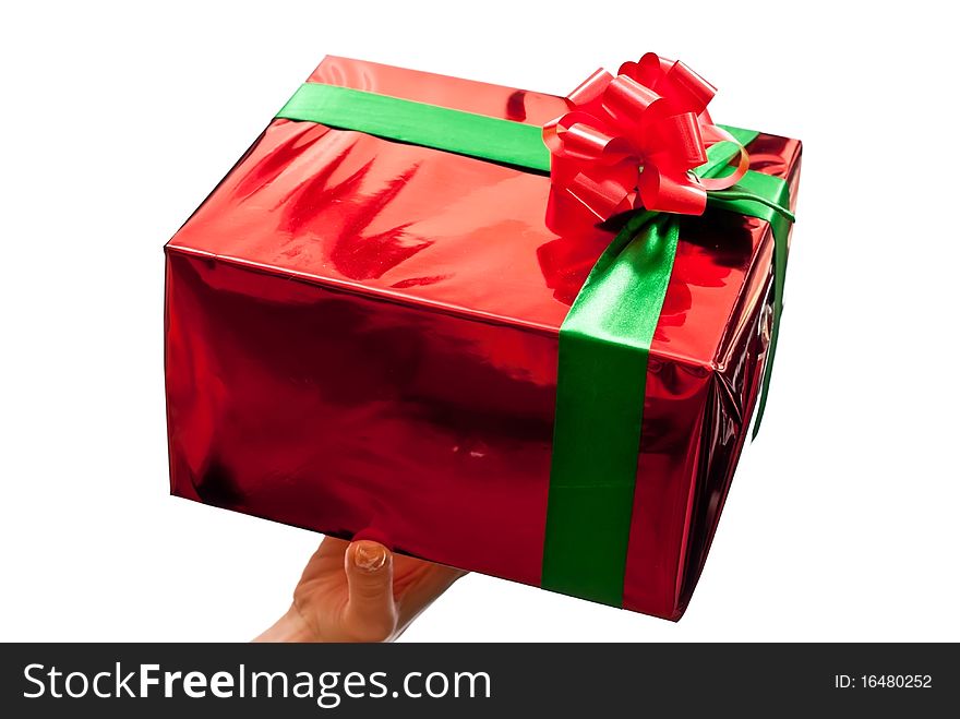 Female hands giving a christmas gift. Isolated on white. Female hands giving a christmas gift. Isolated on white