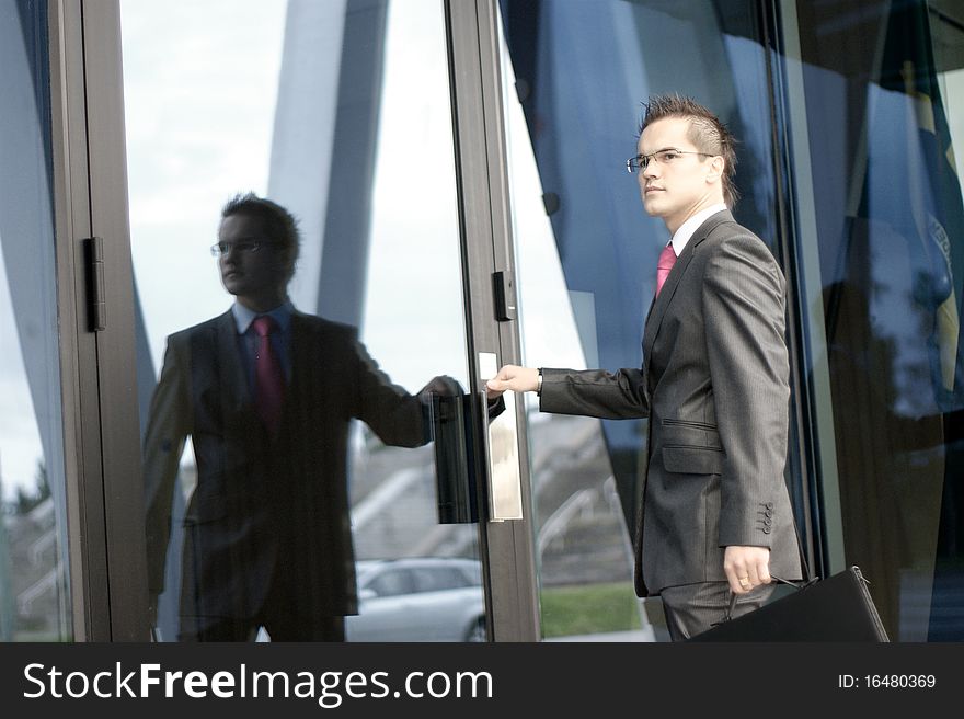 A young businessman entering the office