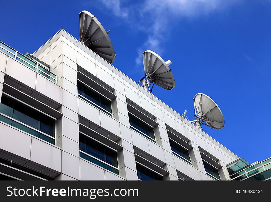 Satellite dishes & communication on a rooftop in a media building, Seattle WA. Satellite dishes & communication on a rooftop in a media building, Seattle WA.