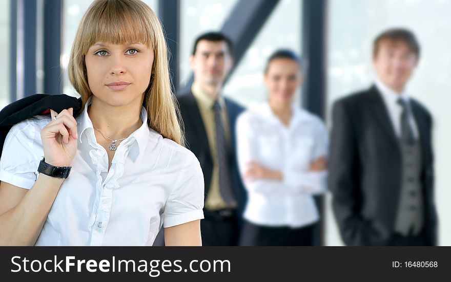 A Young Businesswoman In Front Of Her Colleagues