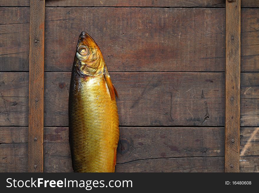 Closeup of fresh bloater lying on wooden background. Closeup of fresh bloater lying on wooden background