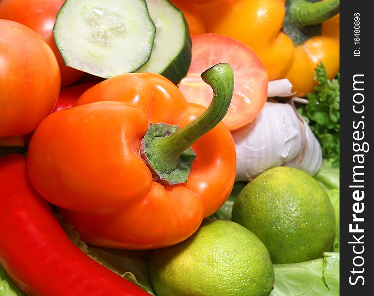 A close-up image of fresh and tasty vegetables including cucumber, pepper, tomato and onion.