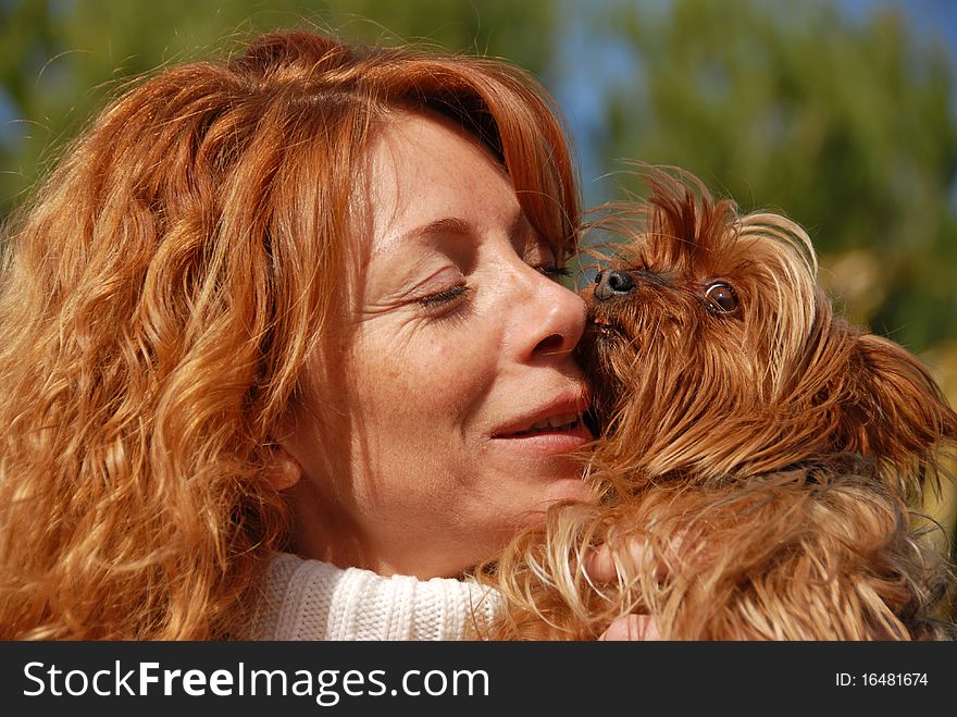 Woman with red hair and her purebred yorkshire terrier. Woman with red hair and her purebred yorkshire terrier