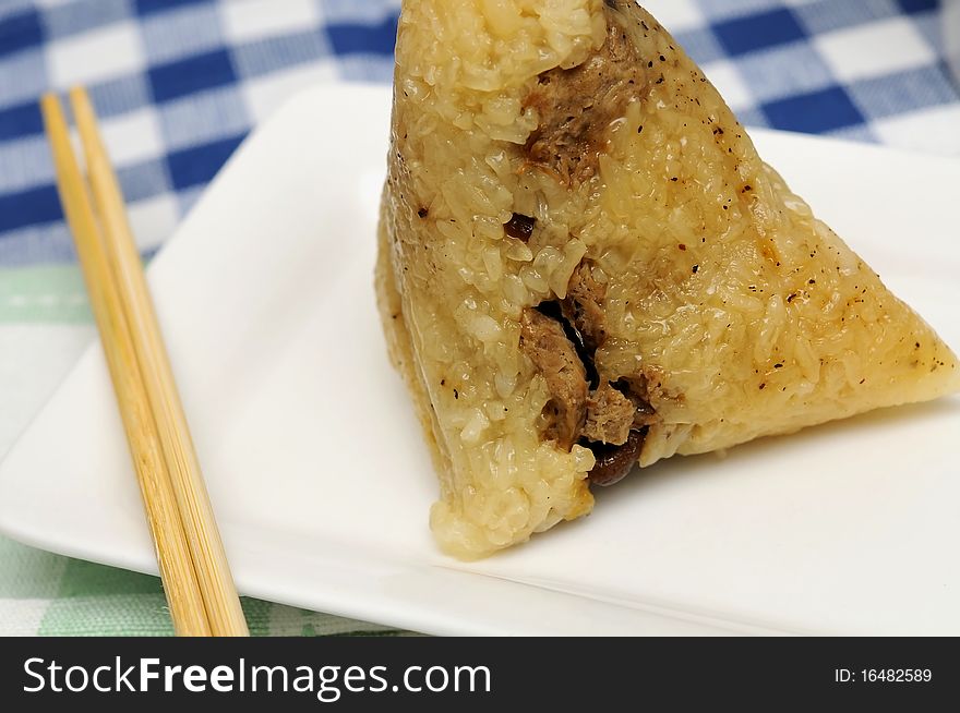 Delicious glutinous rice dumpling with chopsticks. Delicious glutinous rice dumpling with chopsticks.