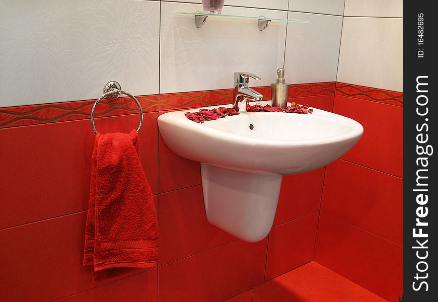 Stylish fashionable washstand in red bathroom