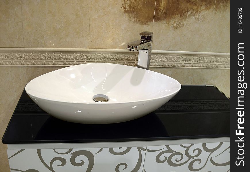 White porcelain washstand in beige bathroom