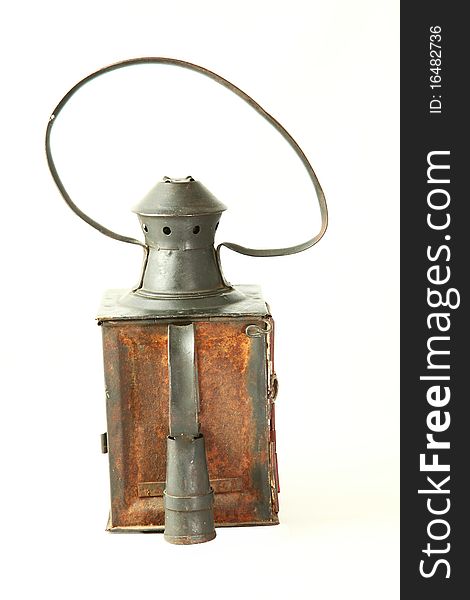 Old rusty railroad lamp with a red glass with Clipping path. Old rusty railroad lamp with a red glass with Clipping path