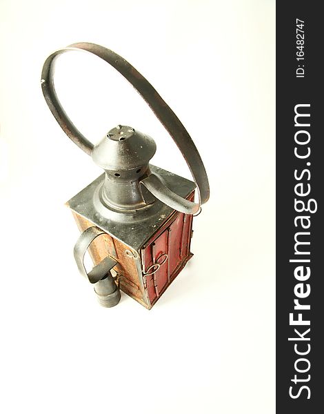 Old rusty railroad lamp with a red glass with Clipping path. Old rusty railroad lamp with a red glass with Clipping path