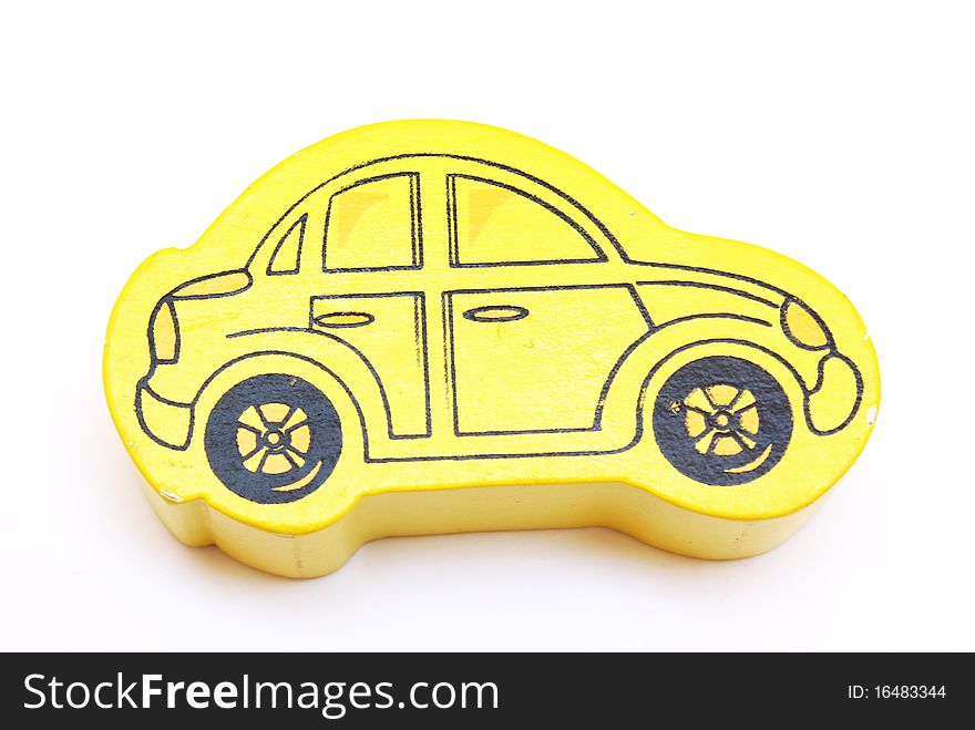 A yellow toy car isolated on white