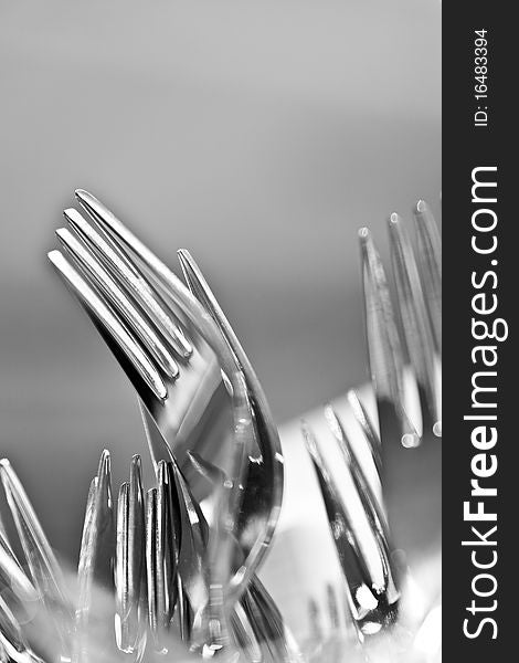 Closeup of shiny forks abstract background