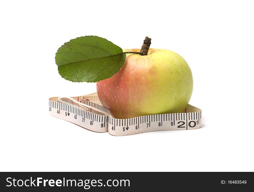 Ripe apple with green sheet and tape-line on a white background. Ripe apple with green sheet and tape-line on a white background.