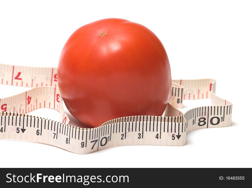 Red tomato and a measuring tape on white background. Red tomato and a measuring tape on white background.