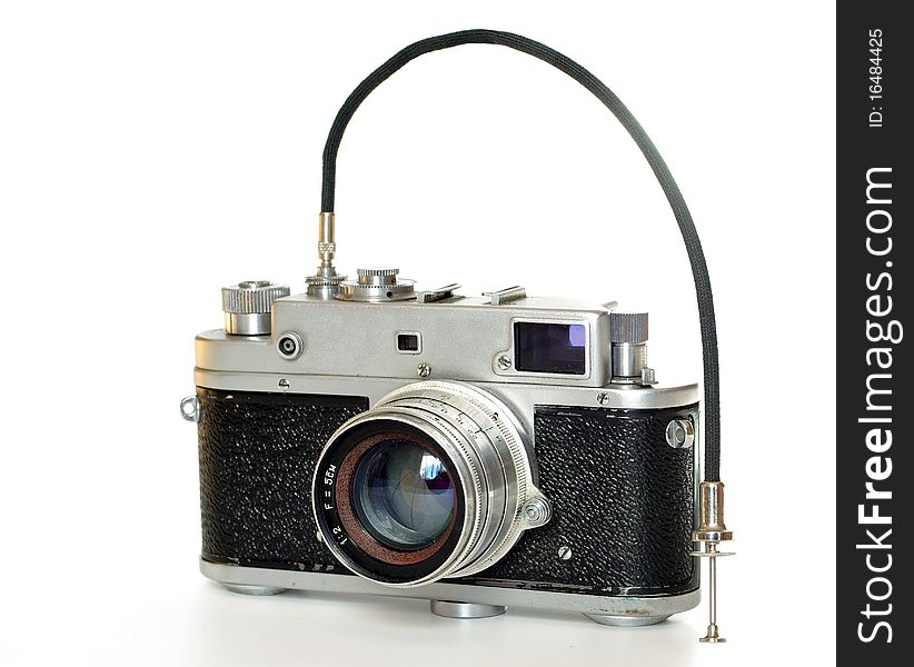 Old photographic  camera on bright background. Old photographic  camera on bright background