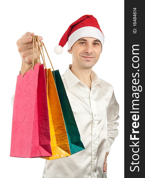 Young men in christmas red hat with paper presents bags isolated on white background
