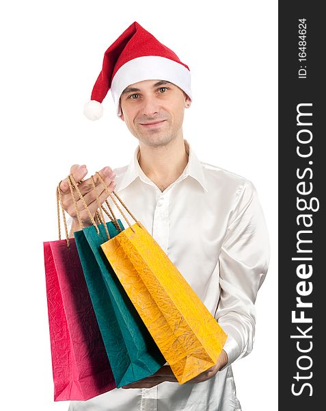 Happy young men in christmas red hat with paper presents bags