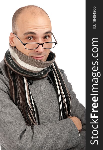 Attractive male wearing a coat and scarf isolated on a white