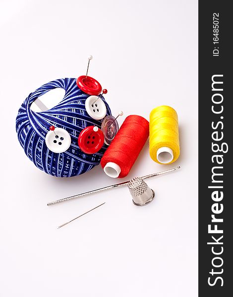 Pins in wool ball with buttons
