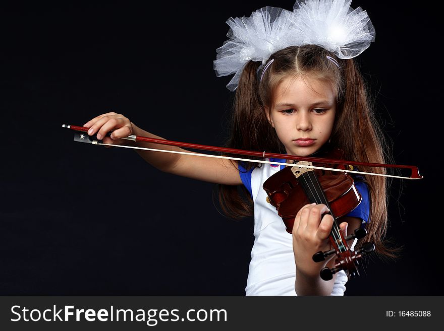 Little girl with violin vs black