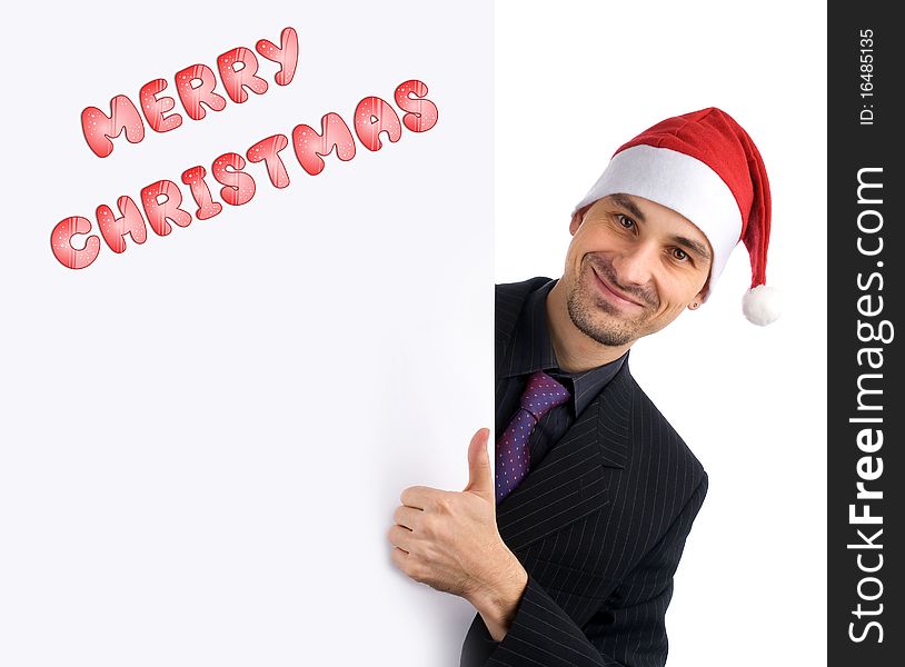 Christmas concept. Young businessman holding blank white card.