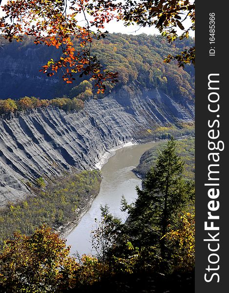 Genesee River flows gracefully through gorge framed with beautiful autumn colors. Genesee River flows gracefully through gorge framed with beautiful autumn colors.