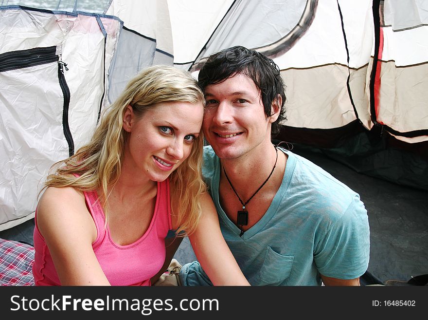 Couple camping and sitting in tent. Couple camping and sitting in tent