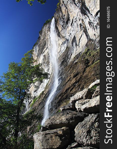 Small waterfall with white waves. Small waterfall with white waves