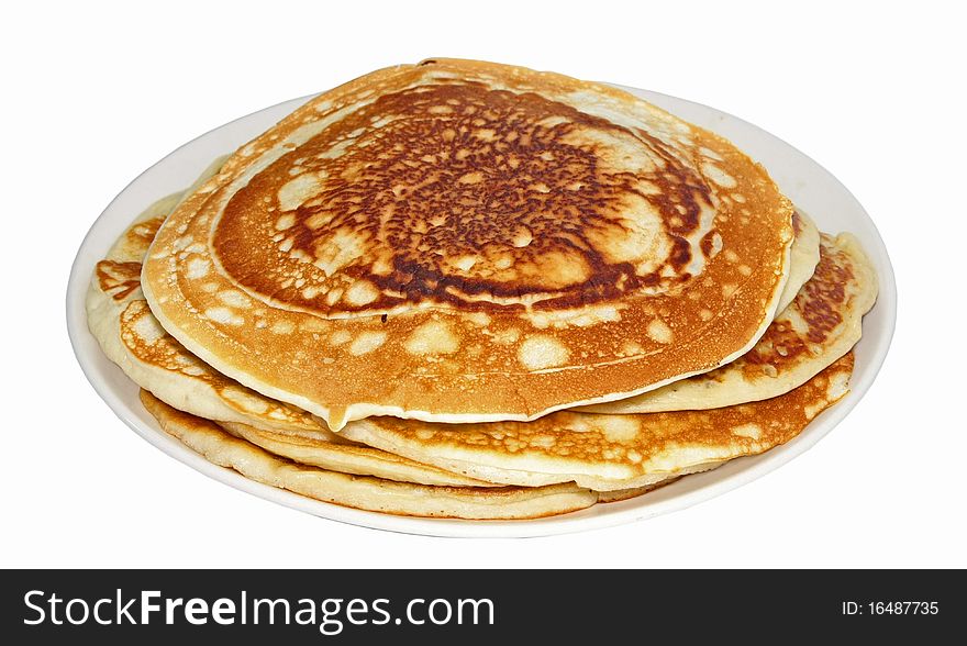 Wheaten pancakes on a plate isolated on a white background