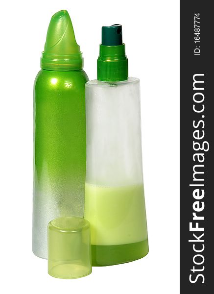 Two green plastic bottles isolated on a white background